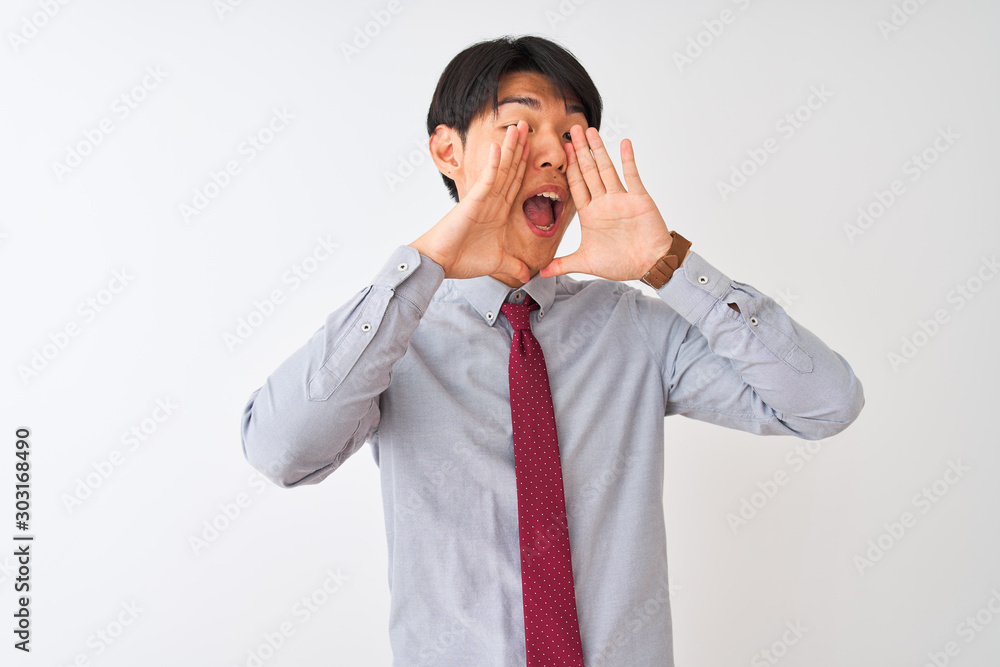 Chinese businessman wearing elegant tie standing over isolated white background Smiling cheerful playing peek a boo with hands showing face. Surprised and exited Chinese businessman wearing elegant tie standing over isolated white background Smiling cheerful playing peek a boo with hands showing face. Surprised and exited