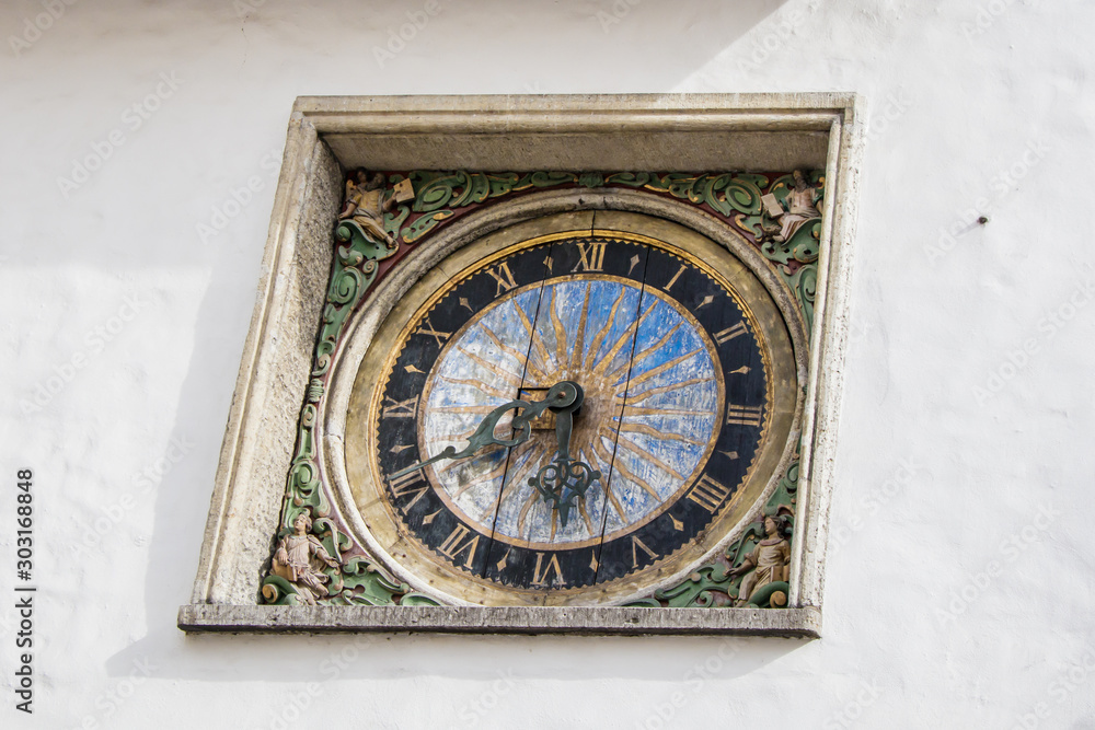 The oldest watch in Tallinn, Estonia. Made in baroque style in 1684. They are still counting the time. Located on the facade of the Church of the Holy Spirit.