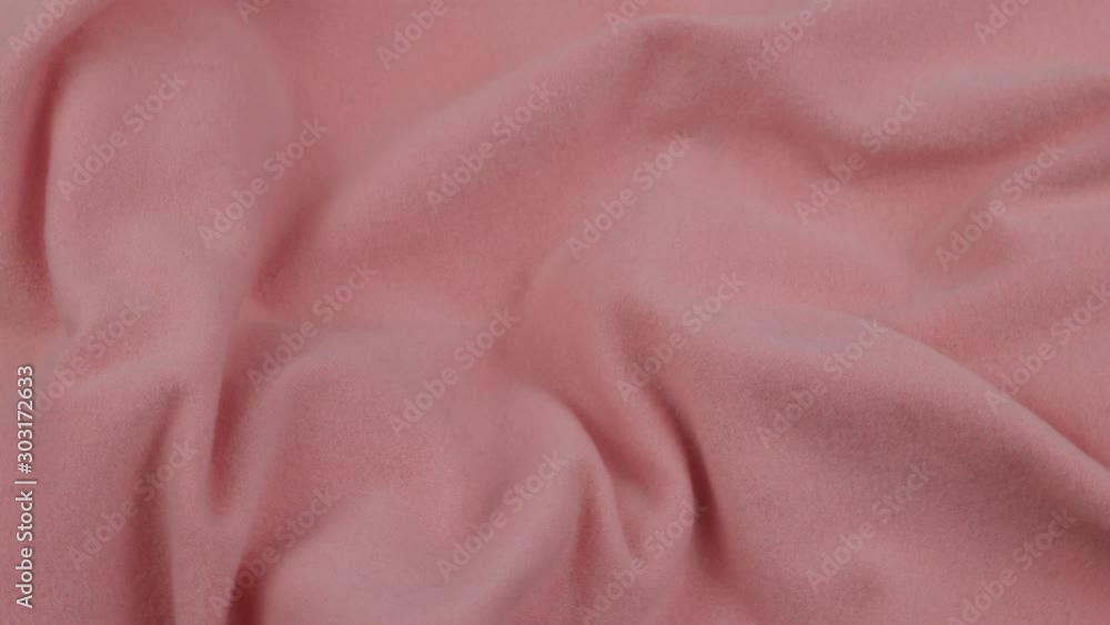 Pale pink velvet is draped with soft pleats, background Pale pink velvet is draped with soft pleats, background