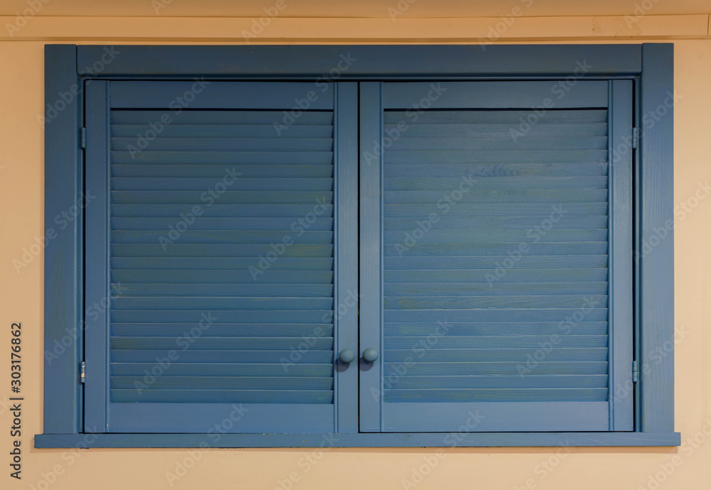 blue wooden shutters on the window blue wooden shutters on the window