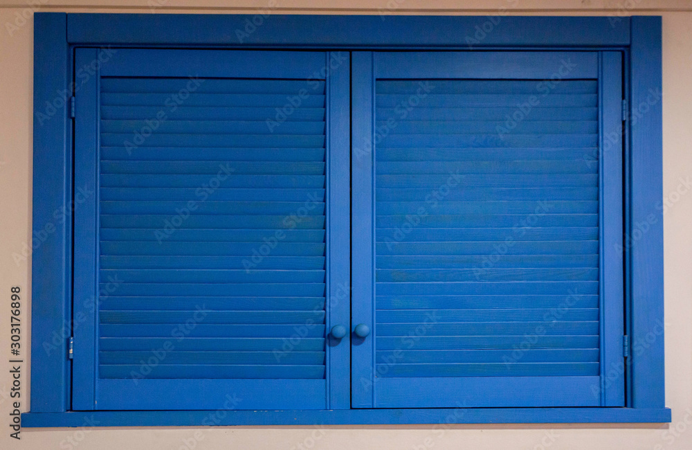 blue wooden shutters on the window blue wooden shutters on the window