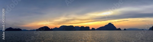 Islands Sunset  Ocean panorama views near Phuket with deep Red  Orange  Purple and Blue  mountains  twilight in Thailand. Including Phi Phi  Ko Rang Yai  Ko Li Pe and other islands. Asia.