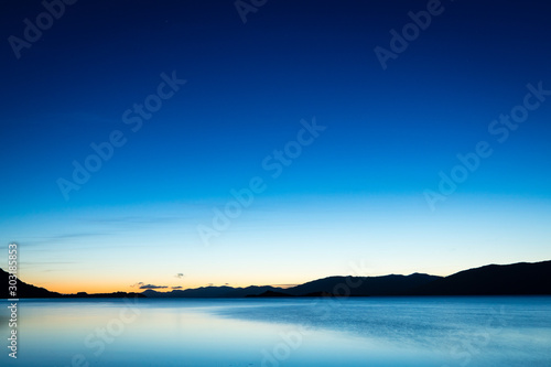 the night sky above loch linnhe in the argyll region of the highlands of scotland near glencoe and fort william on a dark clear winter night