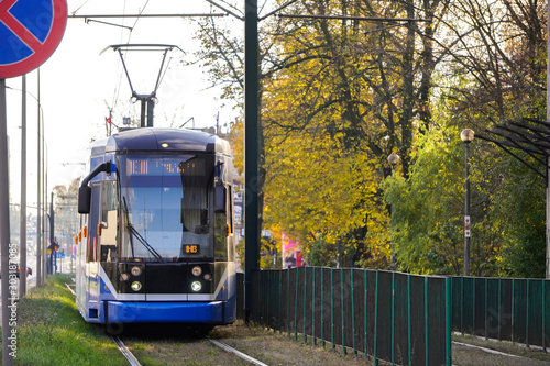 modern tram in autumn city. Rails In Autumn Season with blue tram in city center Krakow.