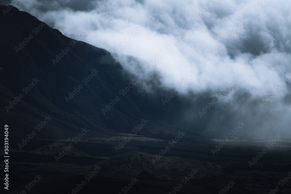 Dramatic clouds flows over volcanic mountains in Hawaii