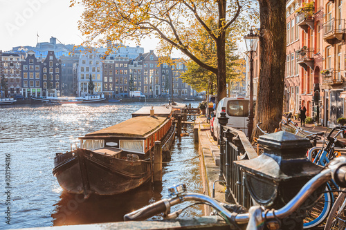 Photography Boat on canal in Amsterdam on a sunny autumn day