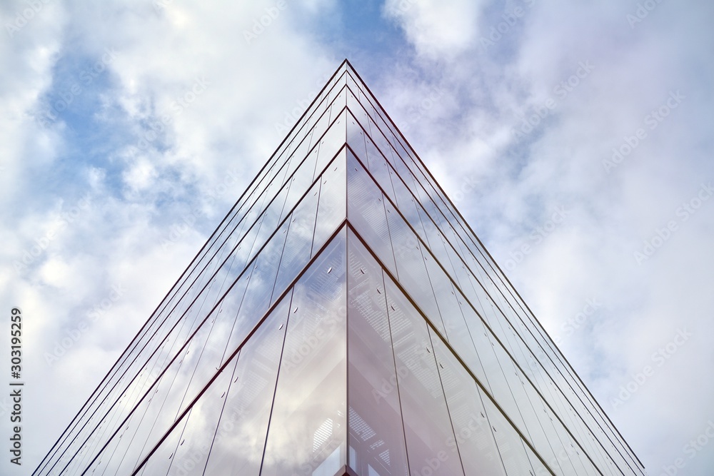 Sky reflected in a modern building glass facade Sky reflected in a modern building glass facade