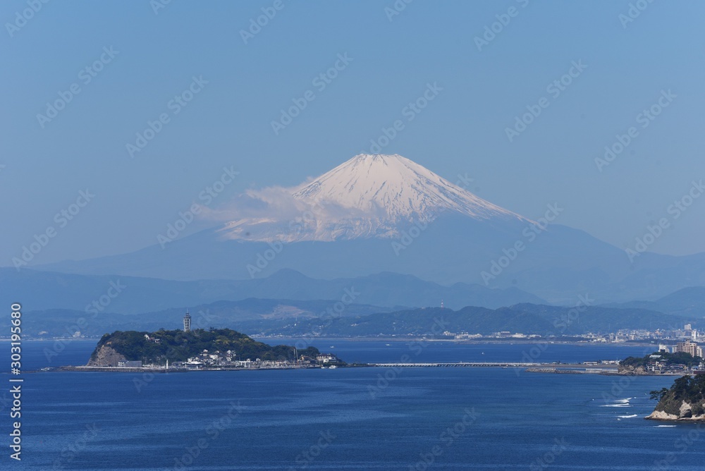 A distant view of the Japanese tourist attraction “Enoshima”. A distant view of the Japanese tourist attraction “Enoshima”.