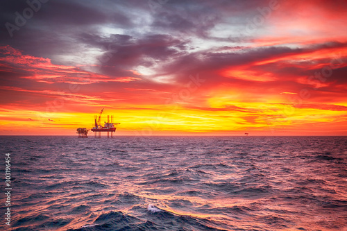 Offshore oil rig at sunset