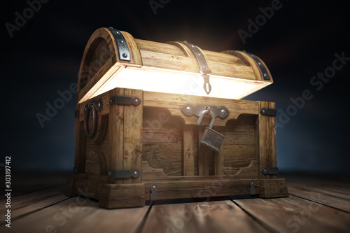 Fototapeta Old wooden treasure chest box with  glow from inside