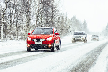 Car in the winter road in Rovaniemi at Lapland, Finland