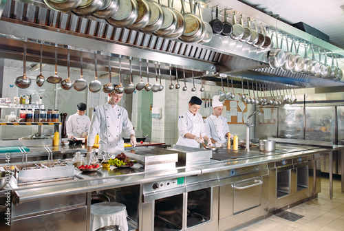 Modern kitchen. The chefs prepare meals in the restaurant s kitchen.