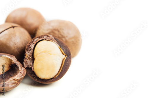 Raw not peeled whole macadamia nuts with shelled kernels
