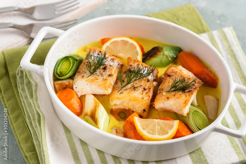 Cod fish baked with vegetables in a lemon sauce.