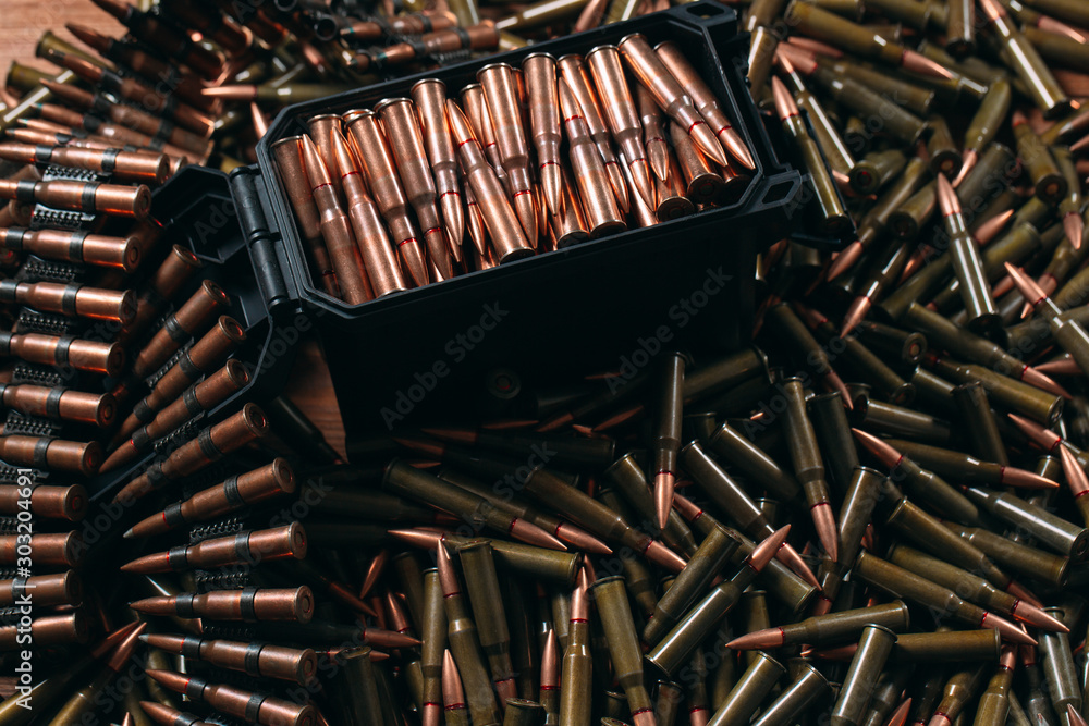 Different ammo on wooden background. Different ammo on wooden background.