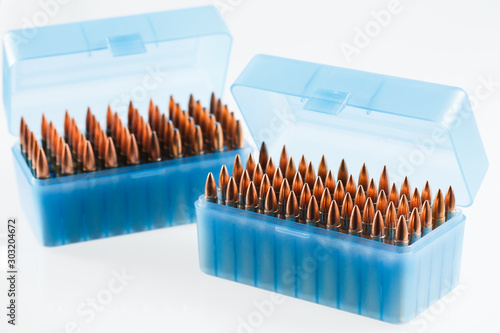 Hunting cartridges in a plastic box. Bullet storage box. photo