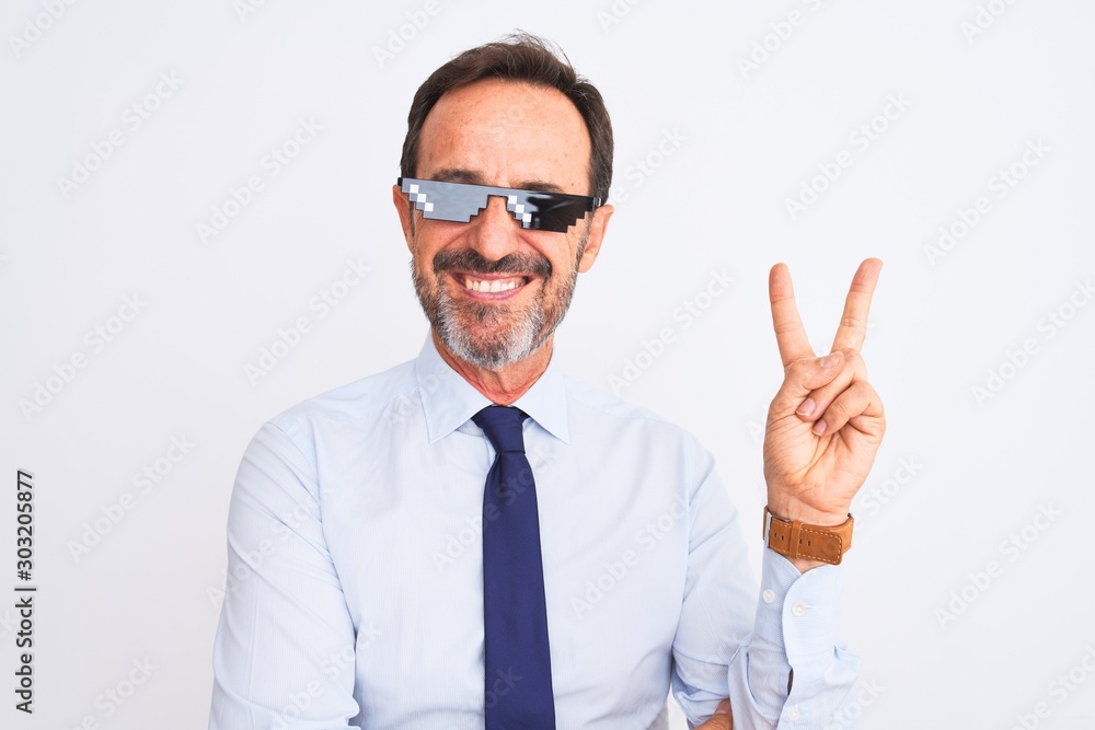 Middle age businessman wearing thug life sunglasses over isolated white background smiling with happy face winking at the camera doing victory sign. Number two.
