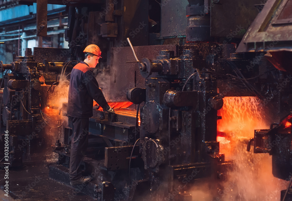Workers in the steel mill. Workers in the steel mill.