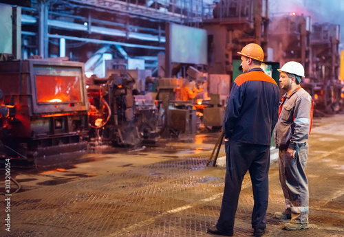 Workers in the steel mill.