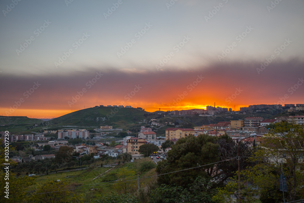 Catanzaro city in calabria, Italy with burning sky at sunset 