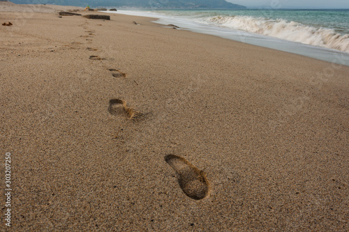Foot prints at a beach in southern Italy