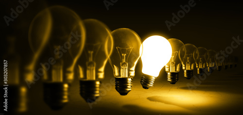 Glowing light bulb on orange background, idea concept