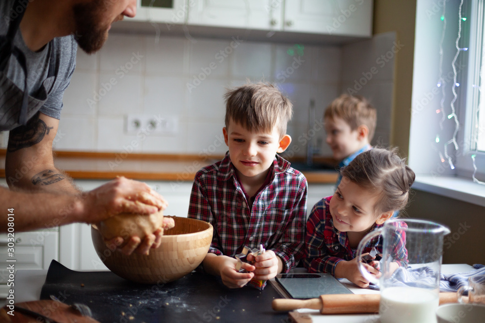 Young family making cookies at home Young family making cookies at home