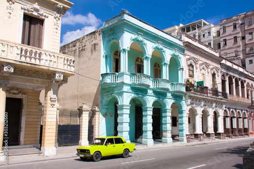 Coche europeo de color fosfórico circulando por el Paseo del Prado o Paseo de Martí en La Habana, Cuba. photo