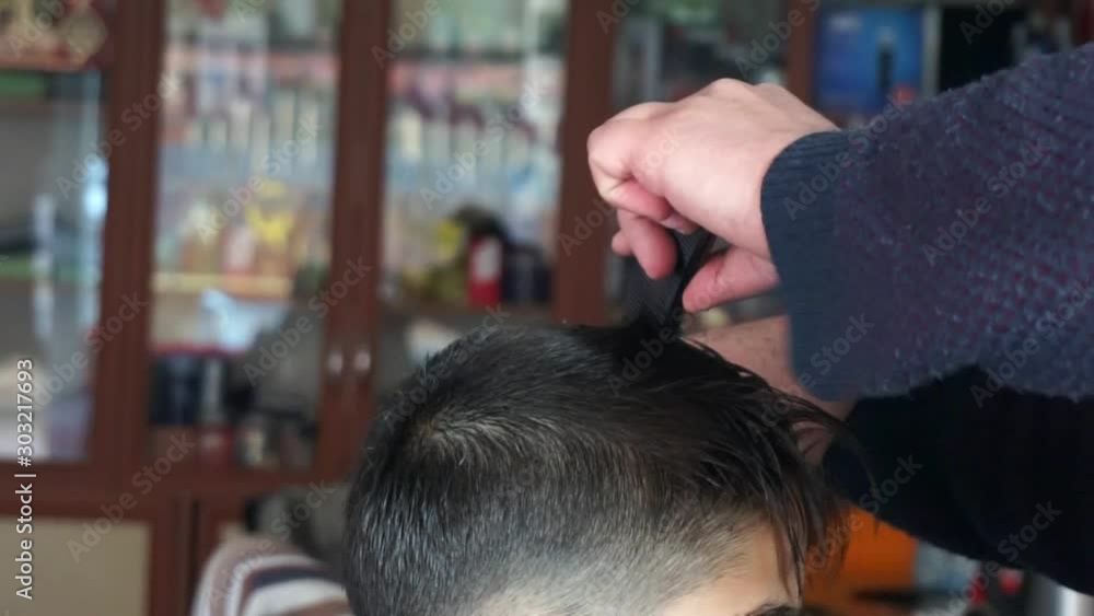 a young child with shaving in the men's barber, a young child with shaving in the men's barber,