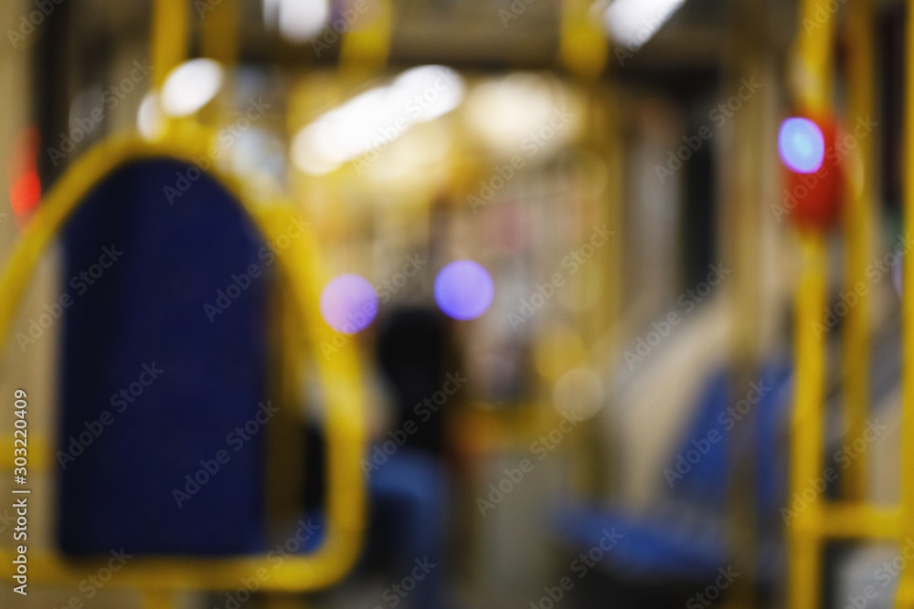 Naklejka premium public transport background in defocus. interior of a tram or bus in the form of a backdrop