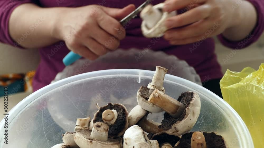 a woman is cutting mushrooms with mushroom knife, prepare mushroom saute, a woman is cutting mushrooms with mushroom knife, prepare mushroom saute,