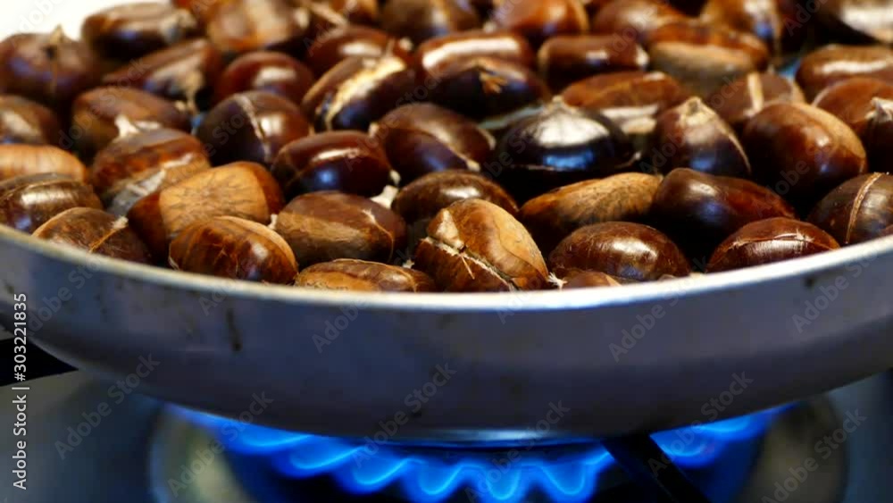 large amount of sweet raw chestnuts. forest products, natural chestnut, chestnuts cooked in a pan, large amount of sweet raw chestnuts. forest products, natural chestnut, chestnuts cooked in a pan,