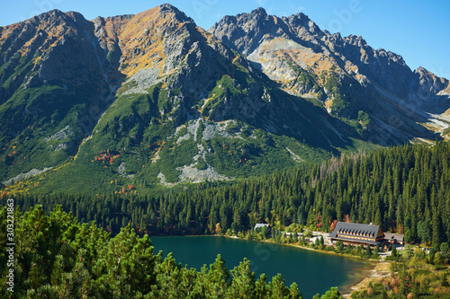 Beautiful lake among the peaks of Hight Tatra mountains. The famous Poprad Lake from the hiking trail of Ostrva peak in Slovakia