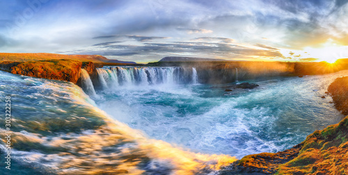 Fantastic sunrise scene of powerful Godafoss waterfall.
