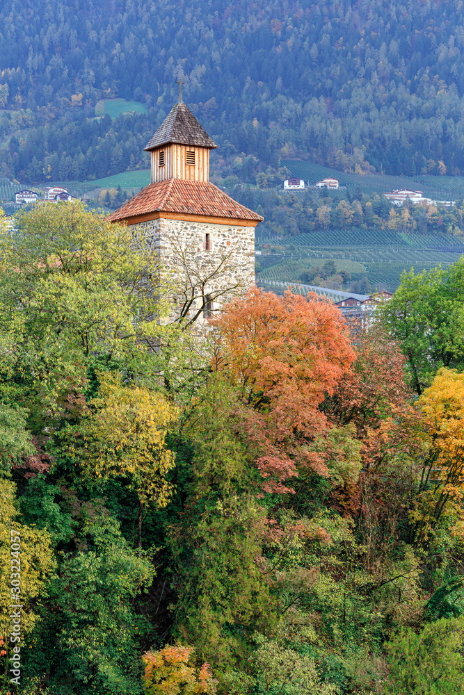 Town of Merano in the fall. View of ruines of the medieval Zenoburg castle on a hill. Merano, Trentino-Alto Adige region, South Tyrol, Italy, Europe.