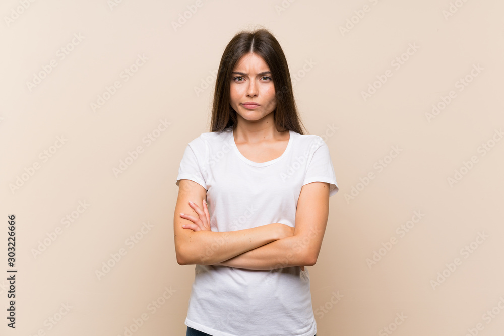 Pretty young girl over isolated background feeling upset Pretty young girl over isolated background feeling upset