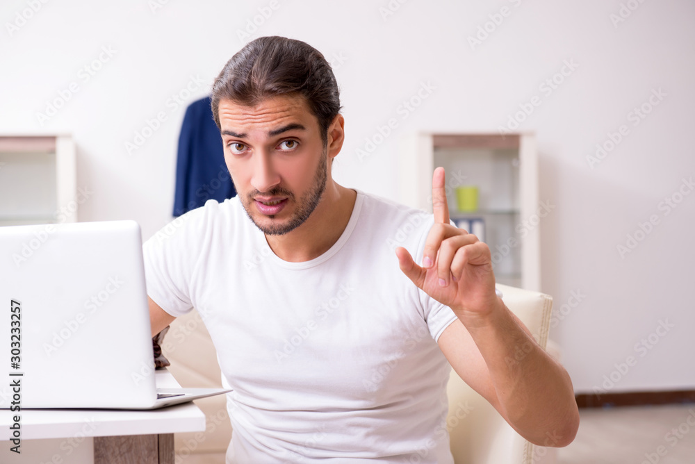 Young male student preparing for exams at home Young male student preparing for exams at home