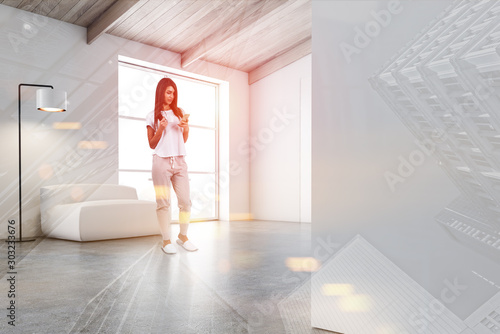 Woman in white living room with armchair