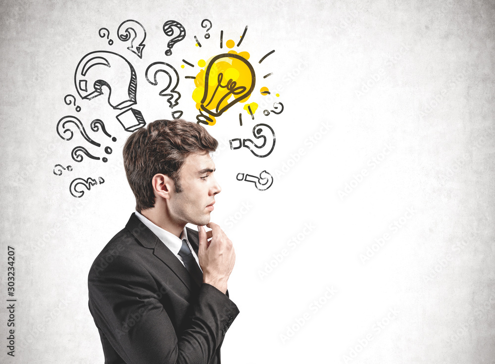 Thoughtful businessman and his bright idea Thoughtful businessman and his bright idea