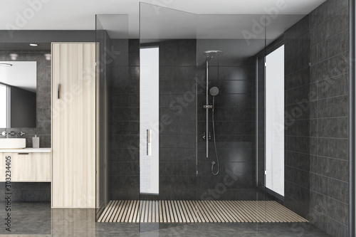 Gray tile bathroom interior with shower photo