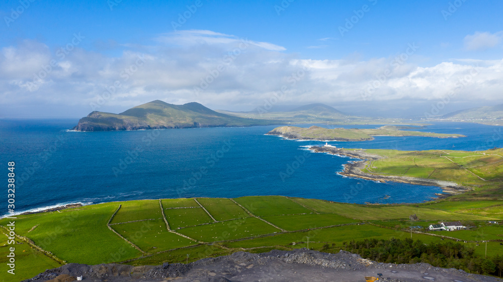 Beautiful view of Valentia Island Lighthouse at Cromwell Point. Scenic Irish countyside on sunny summer day, County Kerry, Ireland.