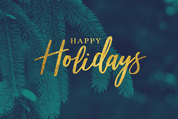 Gold Happy Holidays Christmas Calligraphy Script with Tree Evergreen Background