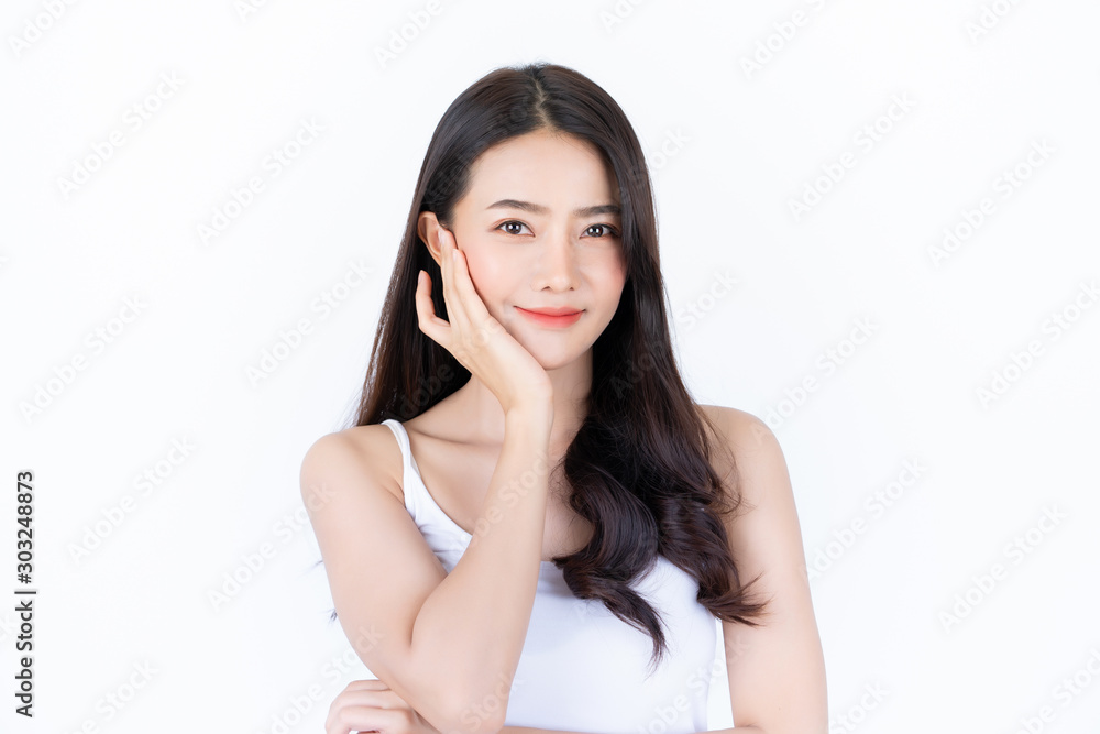 Young asian woman has smiling face and bright skin tone.Asian woman standing with isolated white background. Young asian woman has smiling face and bright skin tone.Asian woman standing with isolated white background.