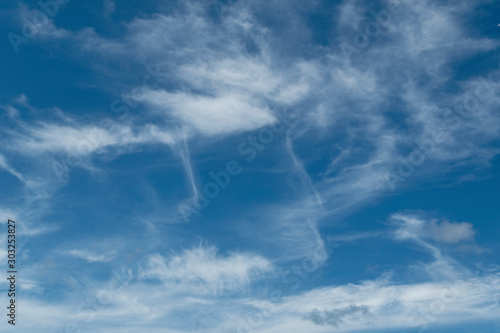 Atmospheric sky art image. White cumulus cloud in vivid blue sky. Australia. photo