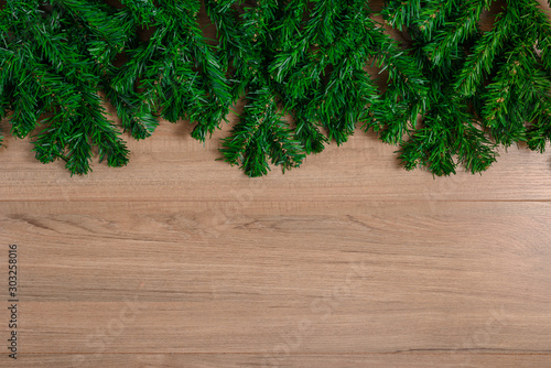 Fir branches on wooden board