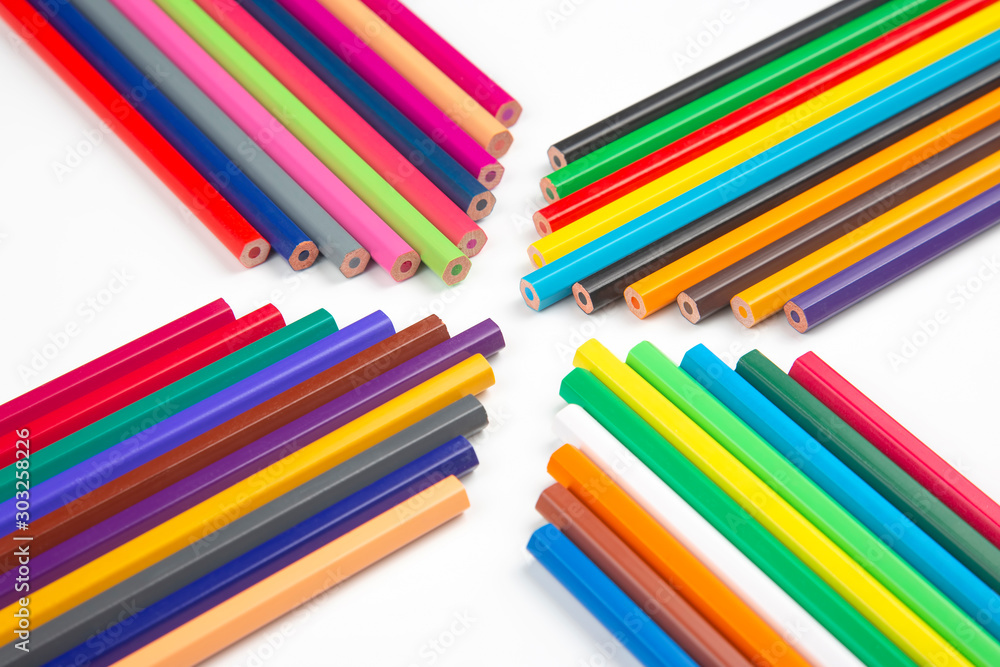 Fototapeta premium Colored pencils for drawing on a white background. Education and creativity. Leisure and art