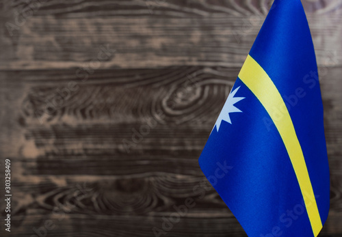 Fragment of the flag of the Republic of Nauru in the foreground blurred background copy space