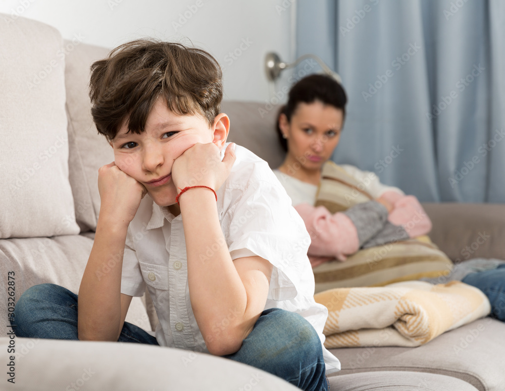 Fototapeta premium Offended tweenager after disagreements with mom
