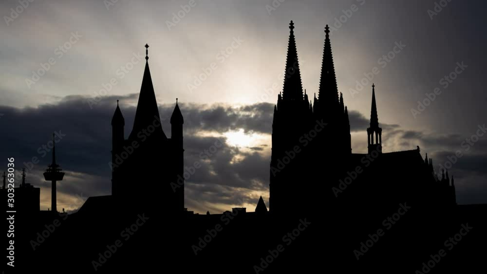 Cologne: Time Lapse at Sunrise with Cathedral, Great St. Martin Church and Skyline of City, Germany Cologne: Time Lapse at Sunrise with Cathedral, Great St. Martin Church and Skyline of City, Germany