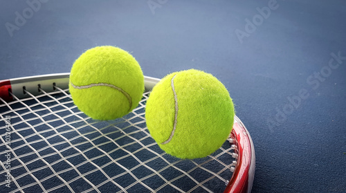 Close up view of tennis racket and balls on the tennis court © Ping198